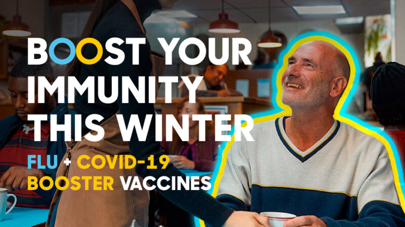 Picture of customer and server chatting at a cafe with the slogan of Boost your immunity this winter with flu and covid vaccines